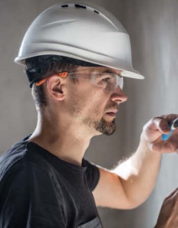 electrical-technician-working-switchboard-with-fuses