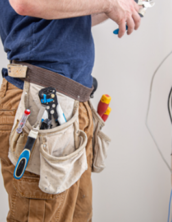electrician-builder-work-examines-cable-connection-electrical-line-fuselage-industrial-switchboard-professional-overalls-with-electrician-s-tool (1)